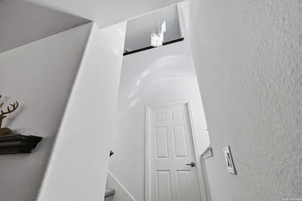 a view of staircase with white walls