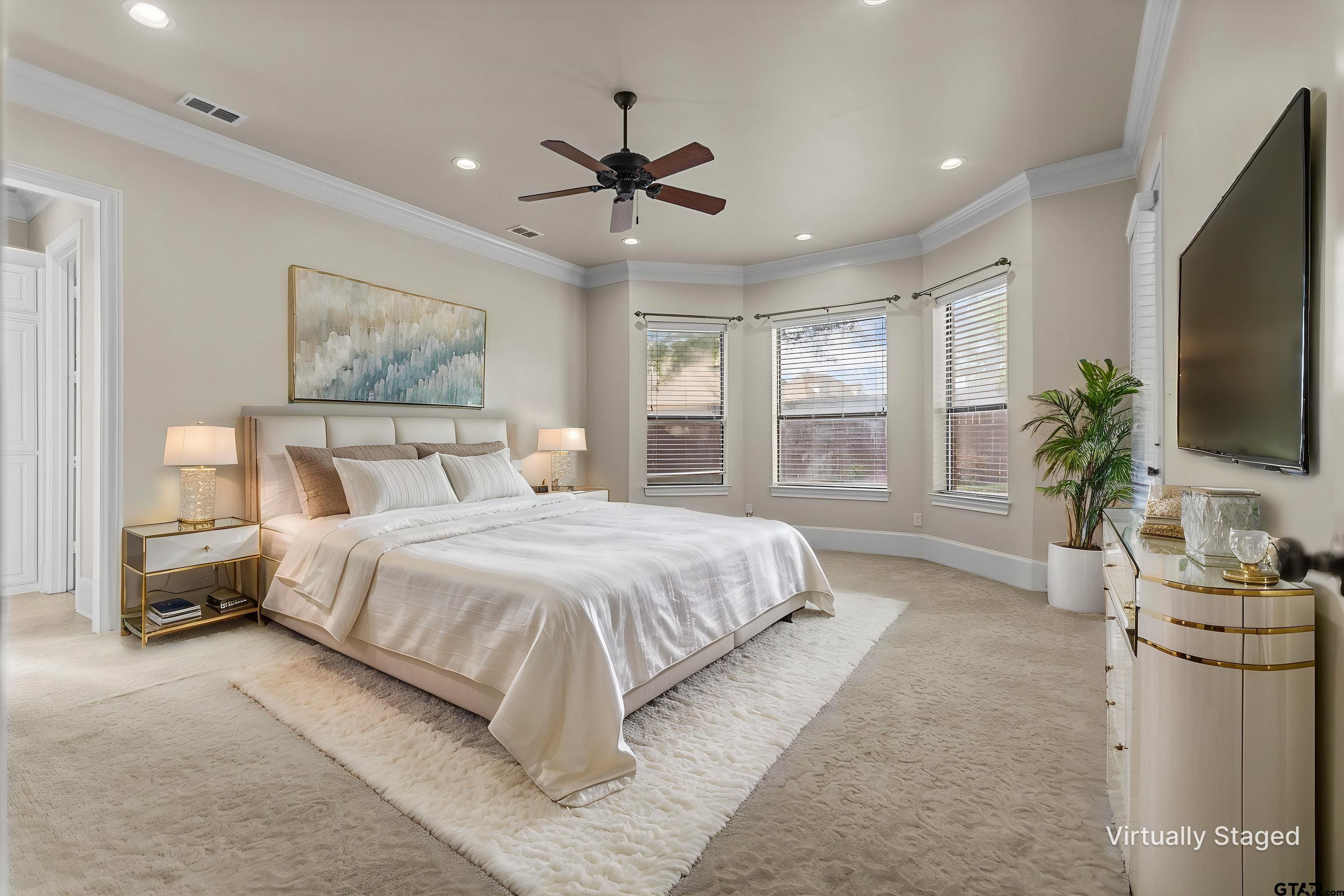2312 Pinehurst Street Tyler, TX 75703 - Photo 12 of 43 a spacious bedroom with a large bed and a flat screen tv