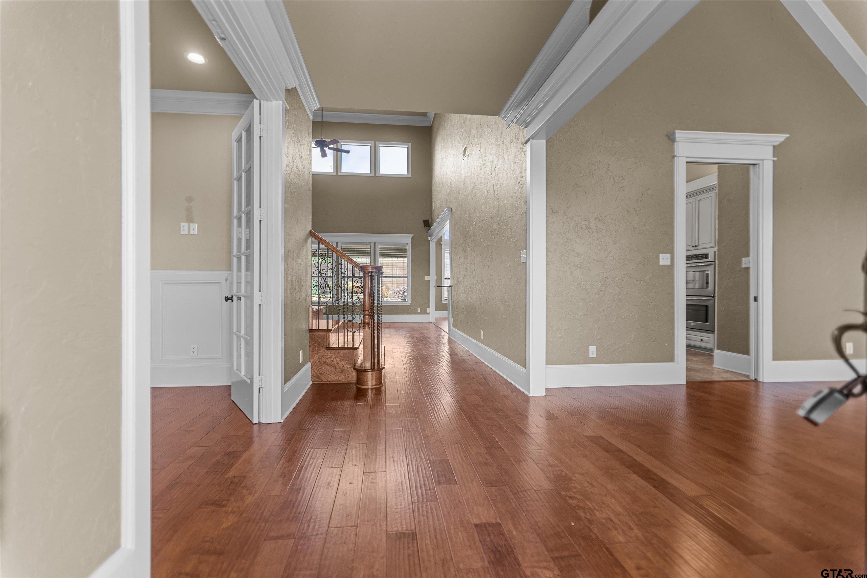 2312 Pinehurst Street Tyler, TX 75703 - Photo 16 of 43 a view of a hallway with wooden floor