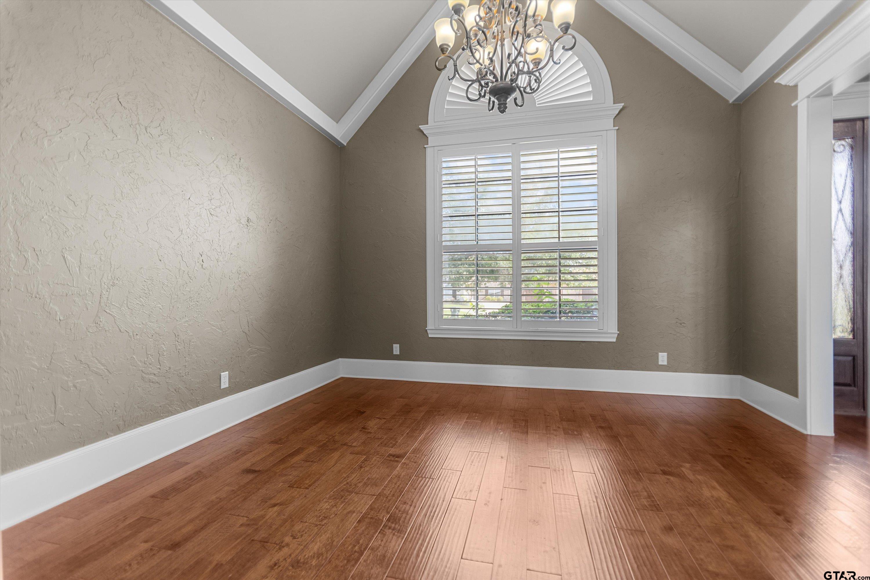 2312 Pinehurst Street Tyler, TX 75703 - Photo 17 of 43 a view of an empty room with wooden floor and a window