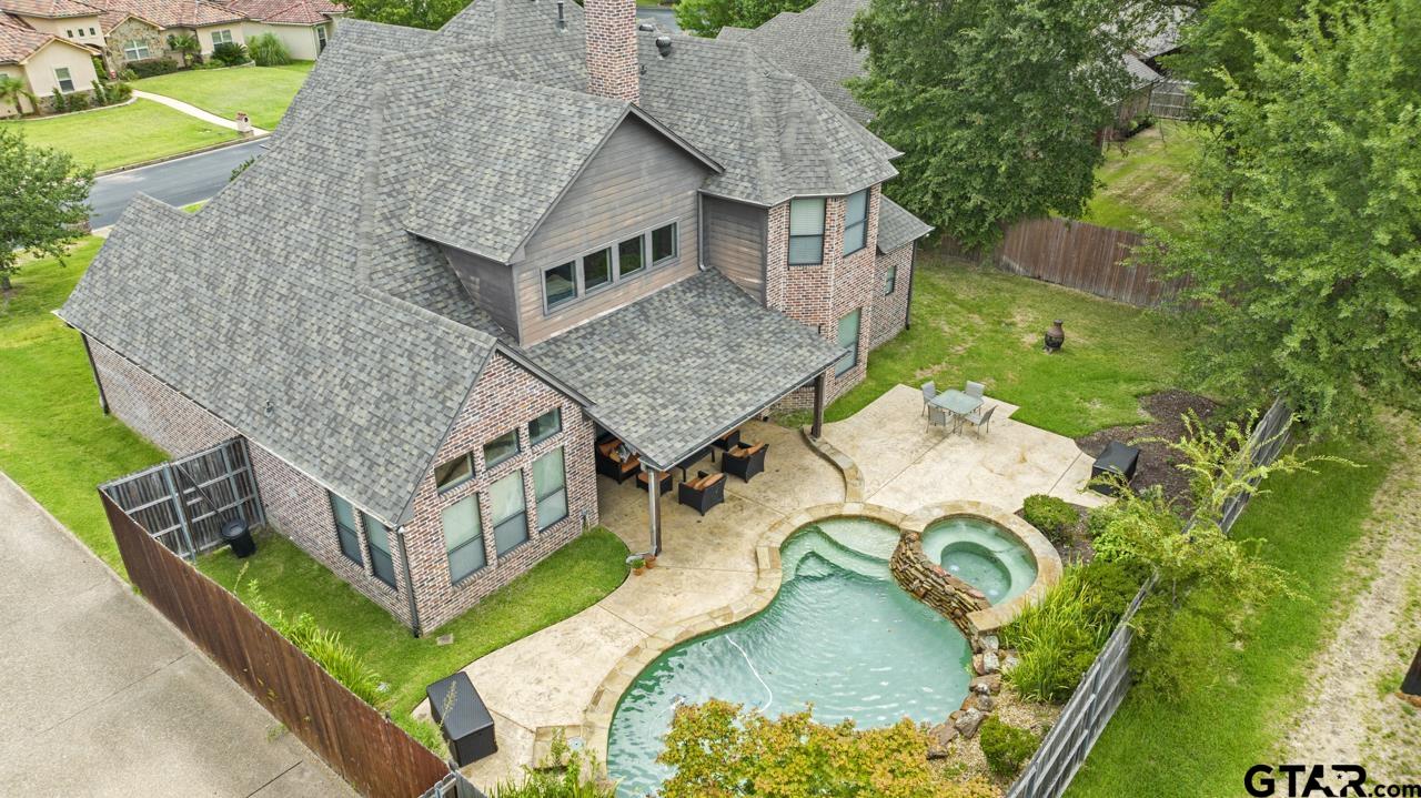 2312 Pinehurst Street Tyler, TX 75703 - Photo 2 of 43 an aerial view of a house with swimming pool and large trees
