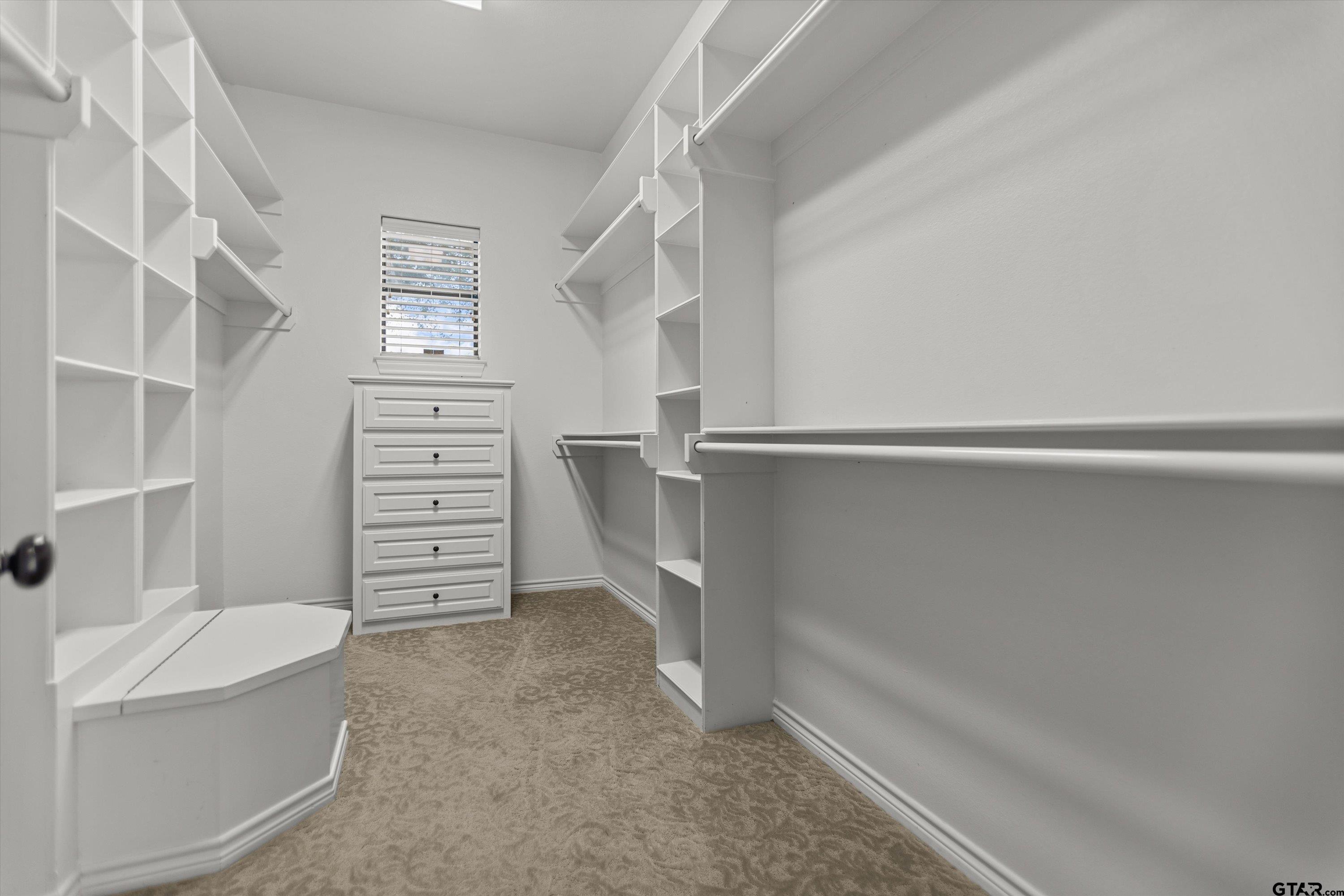 2312 Pinehurst Street Tyler, TX 75703 - Photo 25 of 43 a view of walk in closet with empty racks