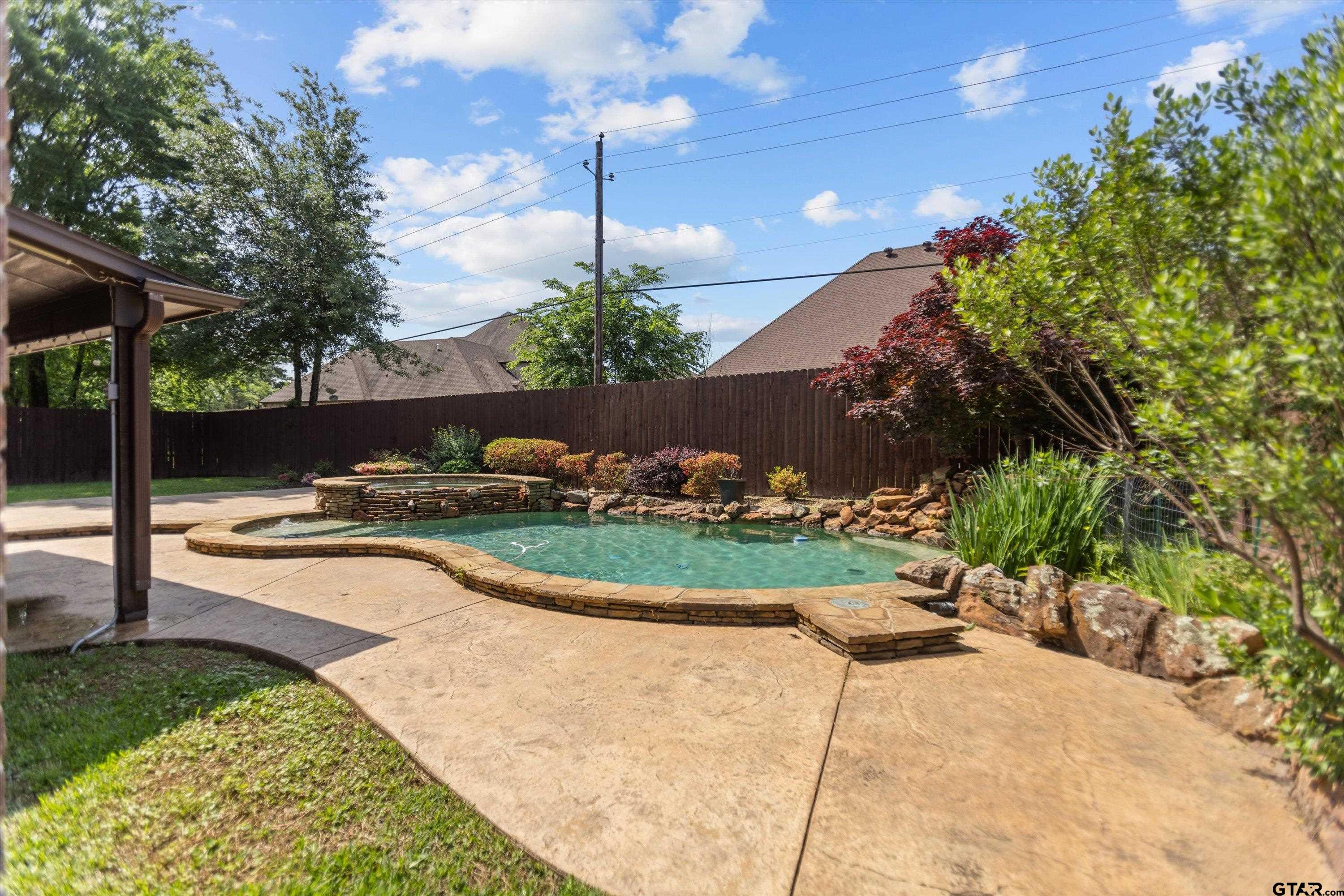 2312 Pinehurst Street Tyler, TX 75703 - Photo 38 of 43 a view of a swimming pool with a yard