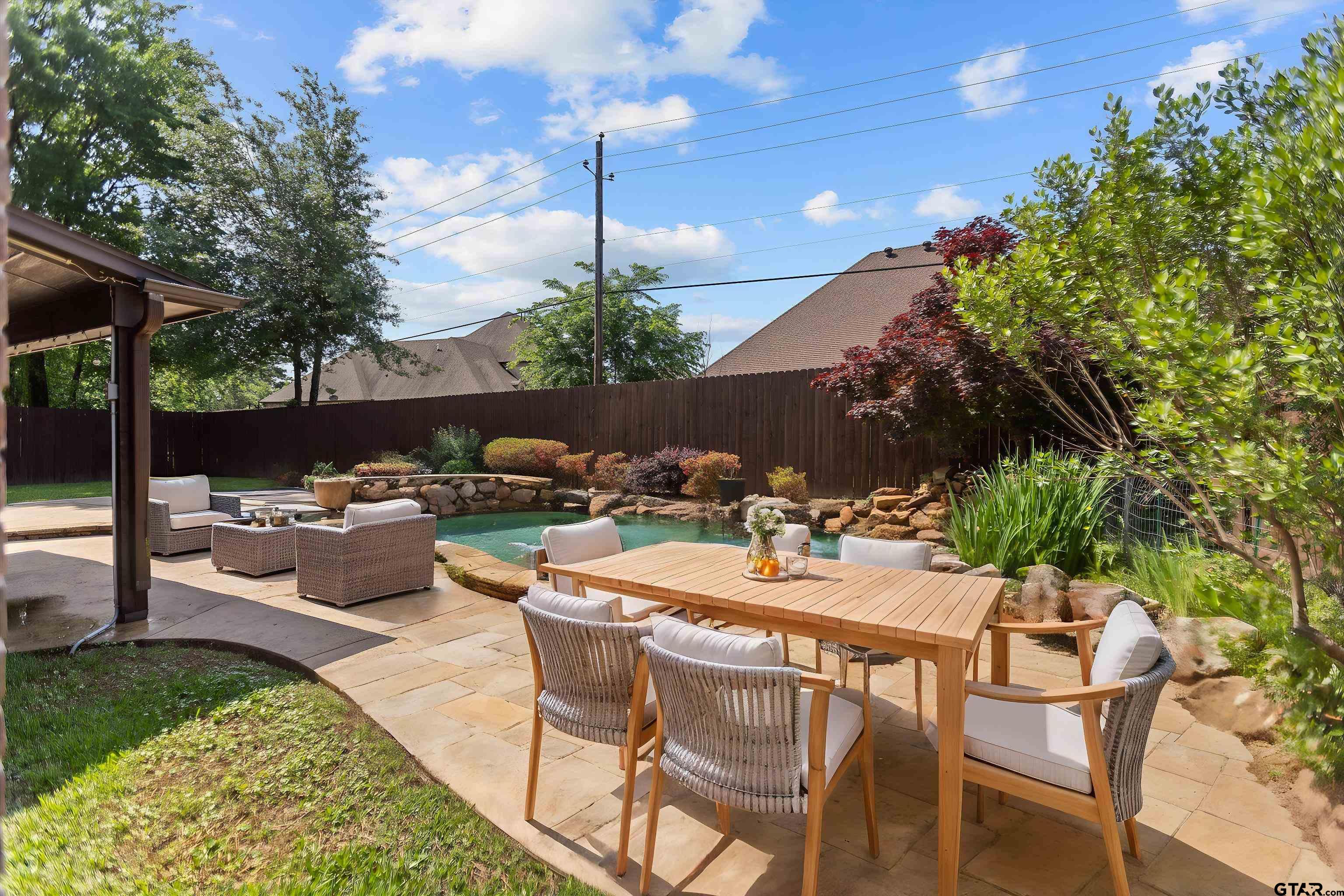 2312 Pinehurst Street Tyler, TX 75703 - Photo 6 of 43 a view of a patio with a table and chairs