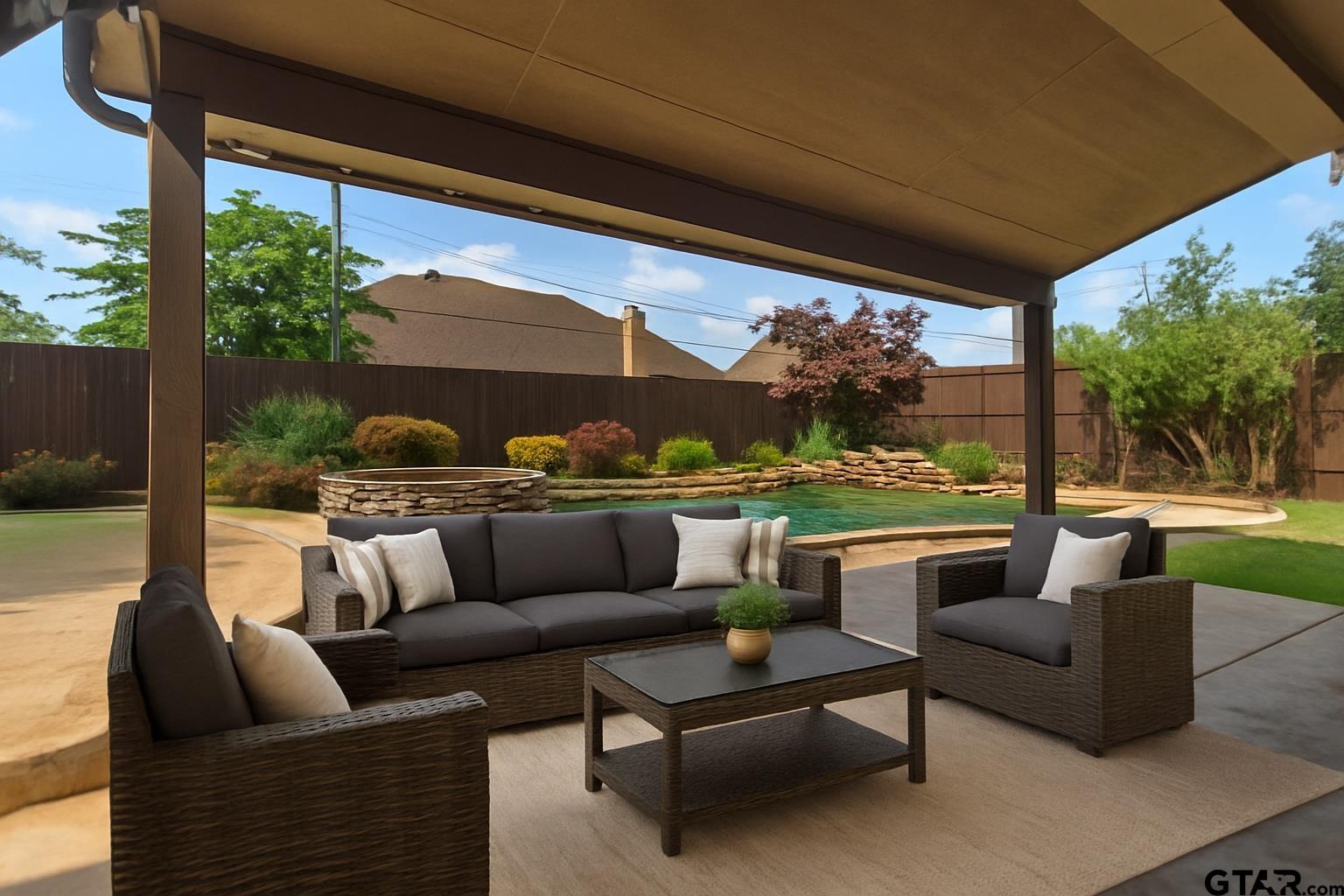 2312 Pinehurst Street Tyler, TX 75703 - Photo 7 of 43 a outdoor living space with patio furniture and a garden