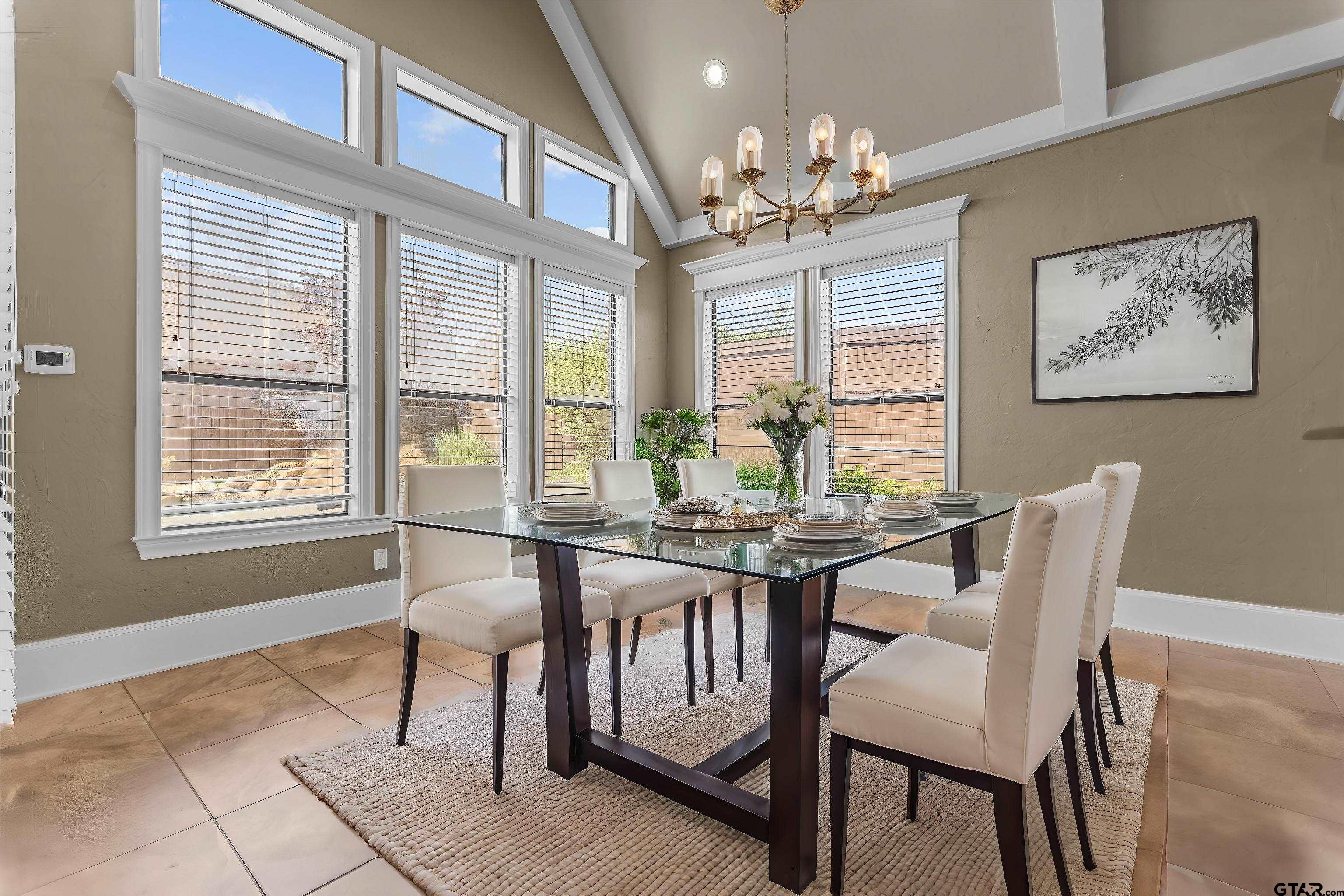 2312 Pinehurst Street Tyler, TX 75703 - Photo 10 of 43 a view of a dining room with furniture and chandelier
