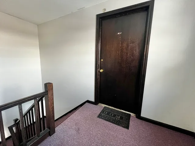 a view of a hallway with closet