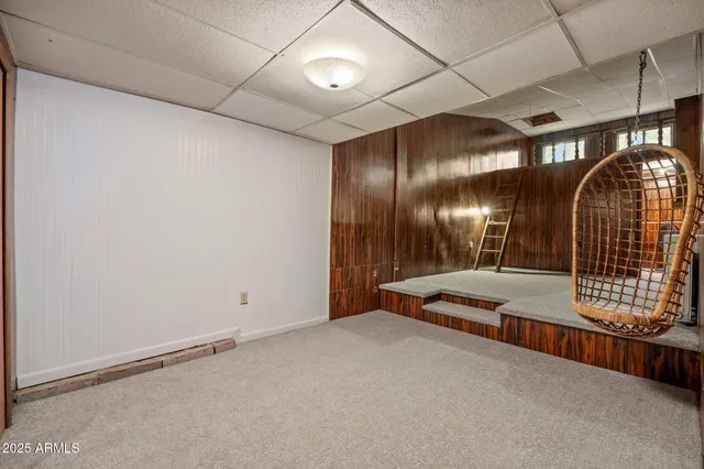 a view of a dining room with furniture wooden floor and a chandelier
