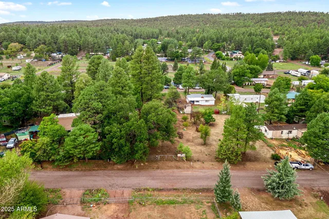 an aerial view of a town with couple of houses
