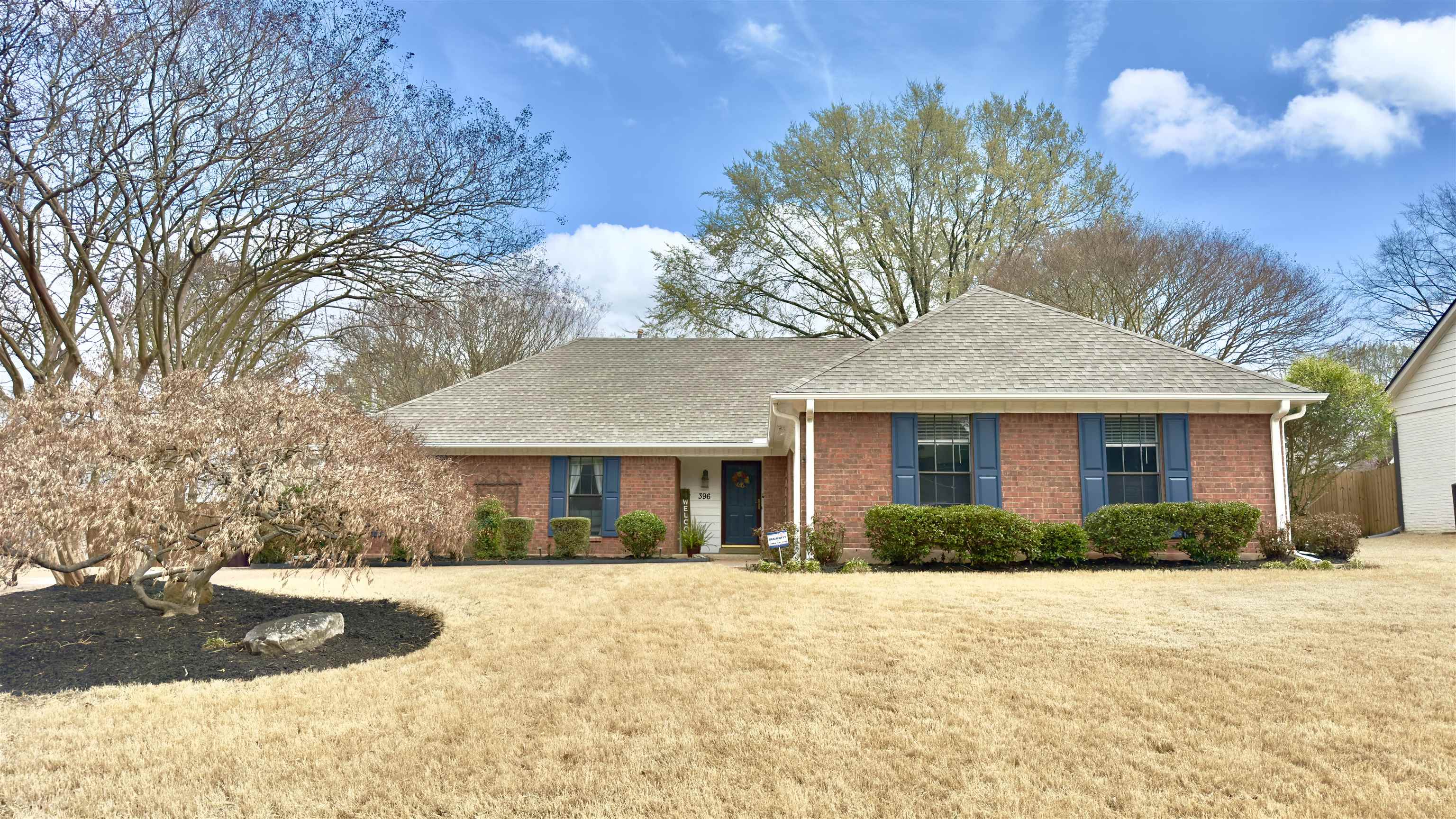 a front view of a house with a yard