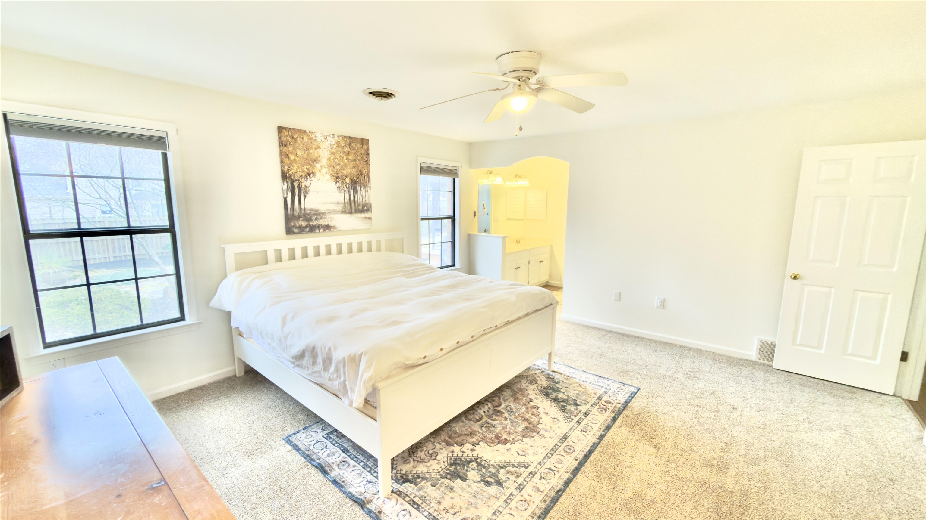 396 North Main Street Collierville, TN 38017 - Photo 12 of 23 a spacious bedroom with a bed and a window