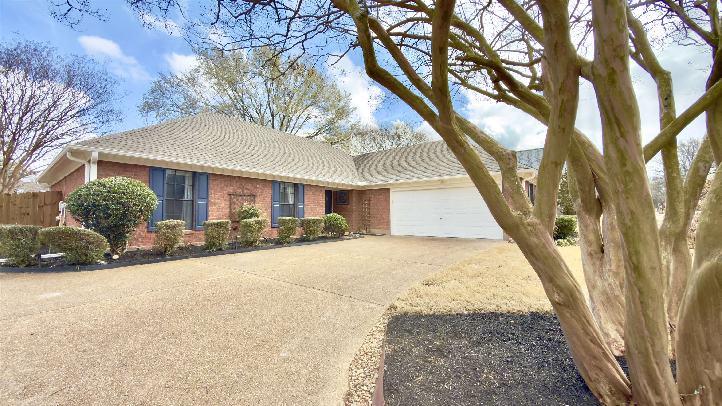 396 North Main Street Collierville, TN 38017 - Photo 2 of 23 a view of a house with a yard and garage