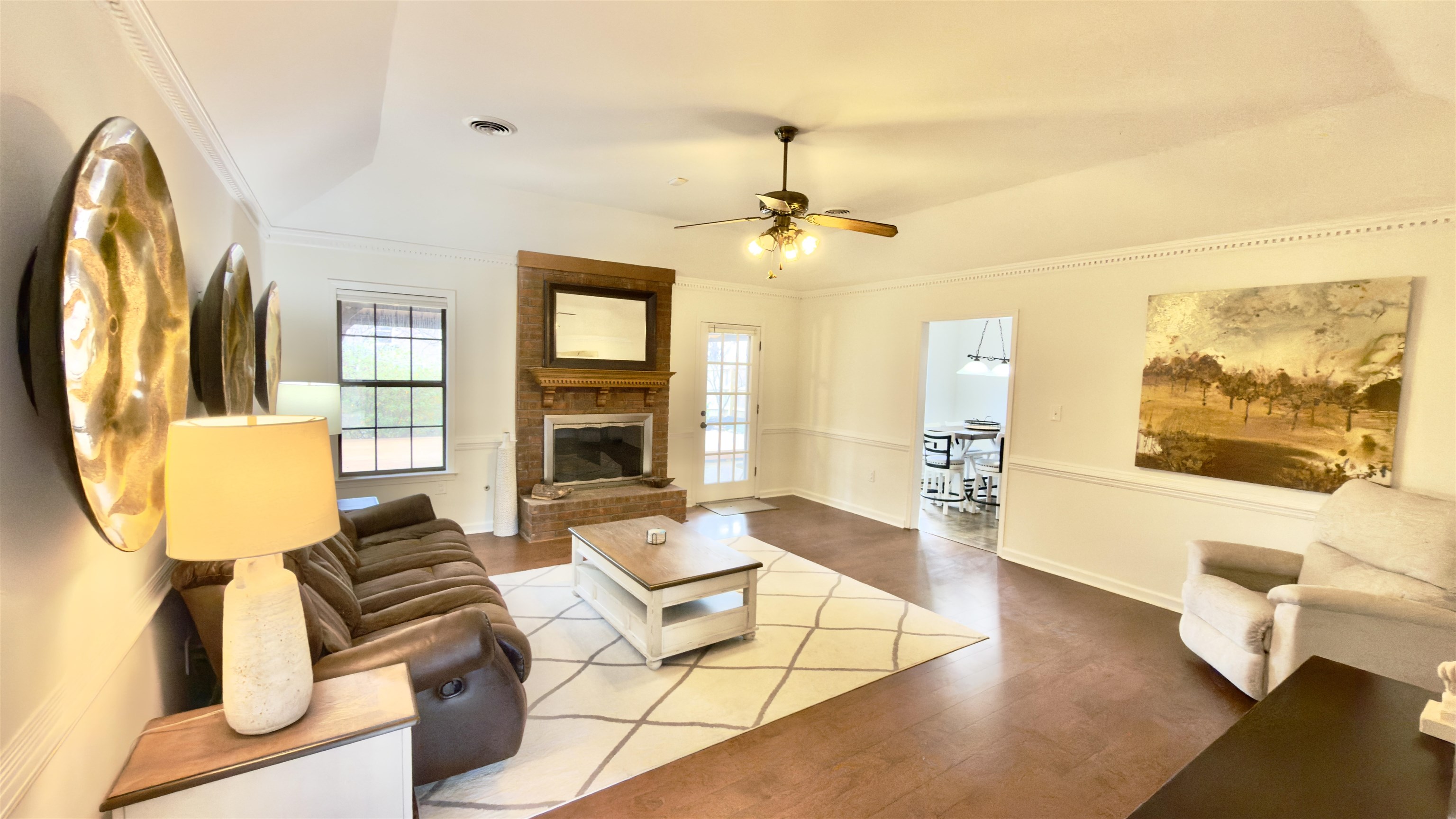 396 North Main Street Collierville, TN 38017 - Photo 4 of 23 a living room with furniture a fireplace and a flat screen tv