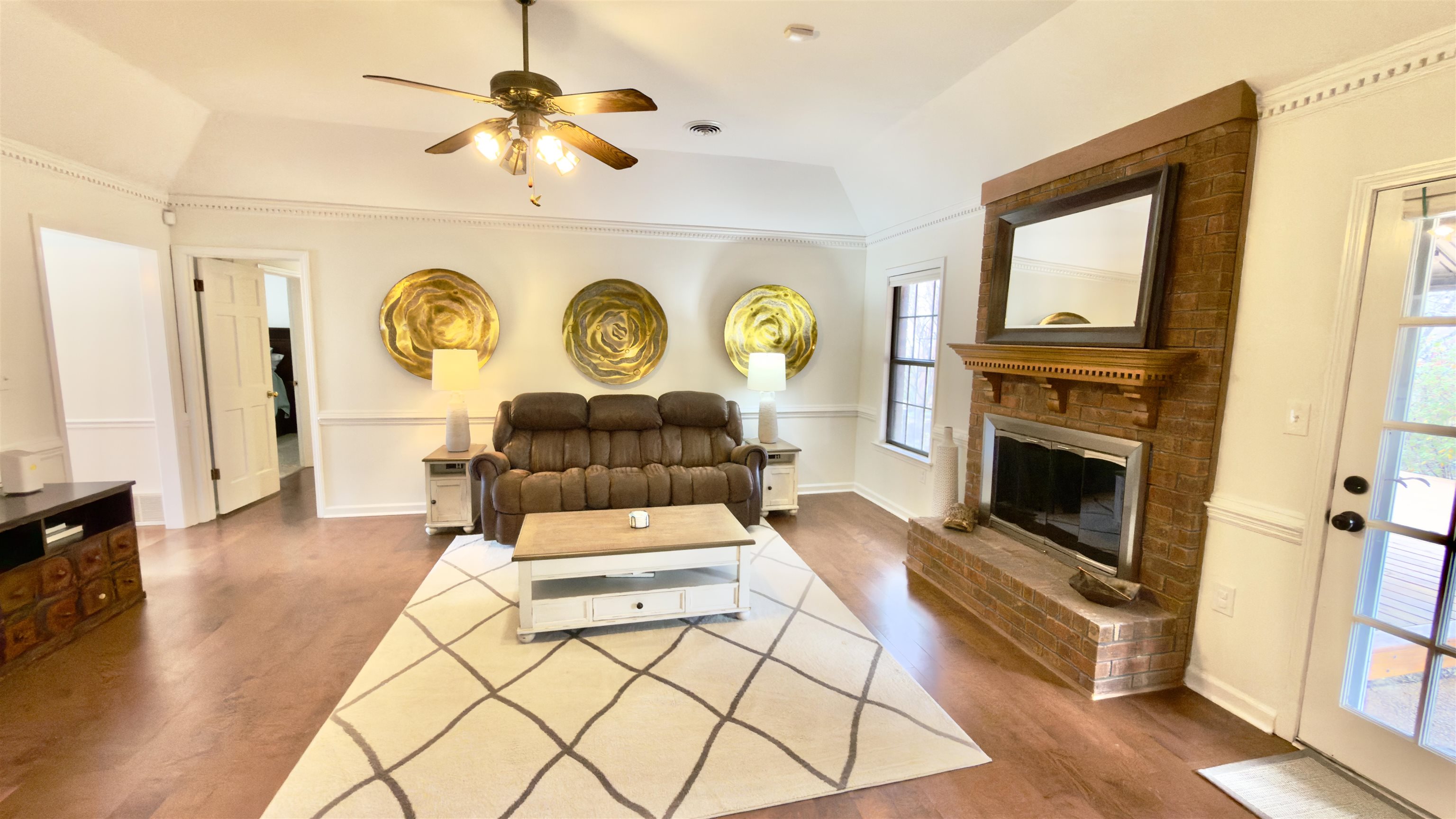 396 North Main Street Collierville, TN 38017 - Photo 5 of 23 a living room with furniture a clock and a fireplace