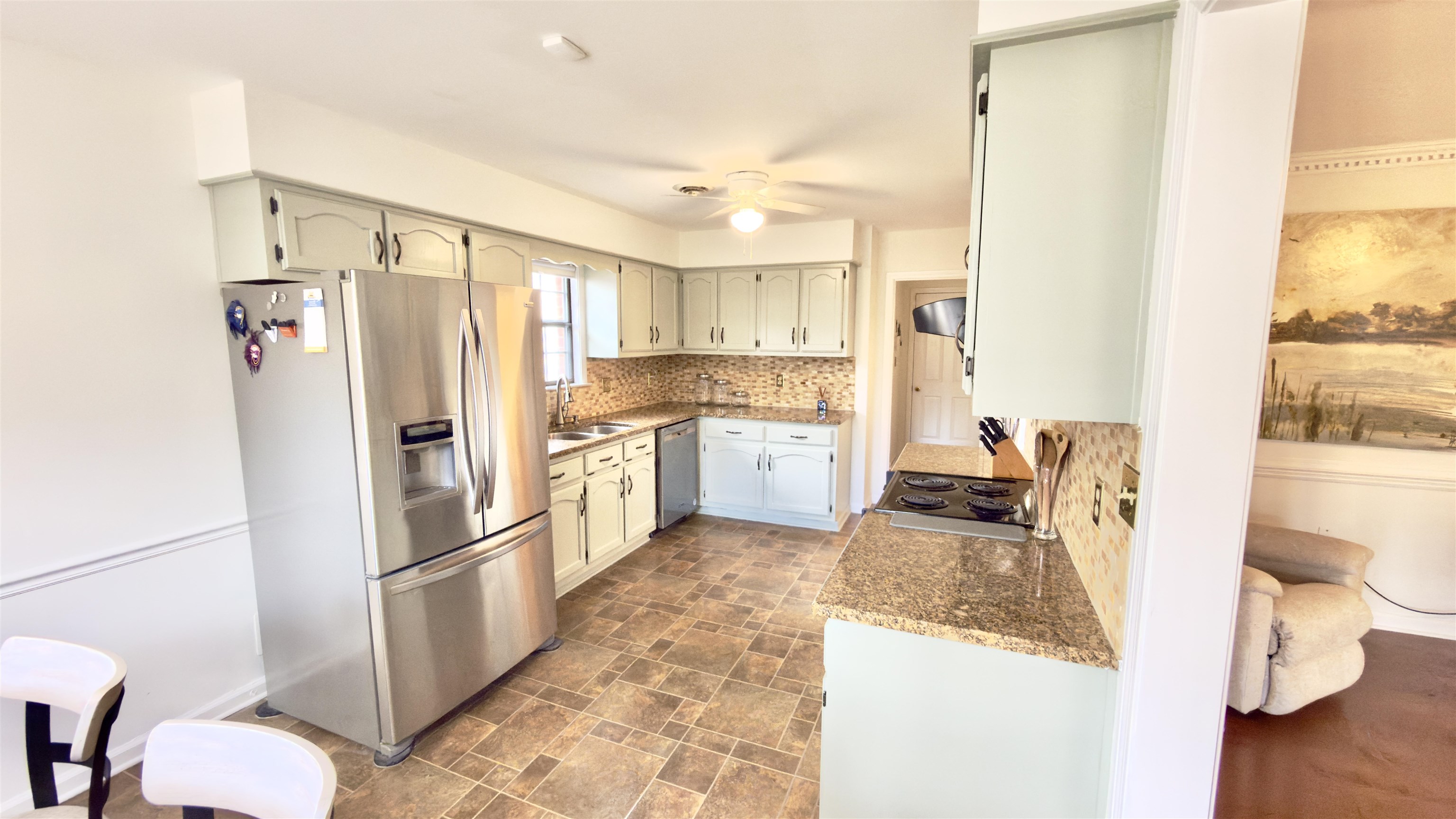 396 North Main Street Collierville, TN 38017 - Photo 6 of 23 a kitchen with stainless steel appliances granite countertop a refrigerator and a stove