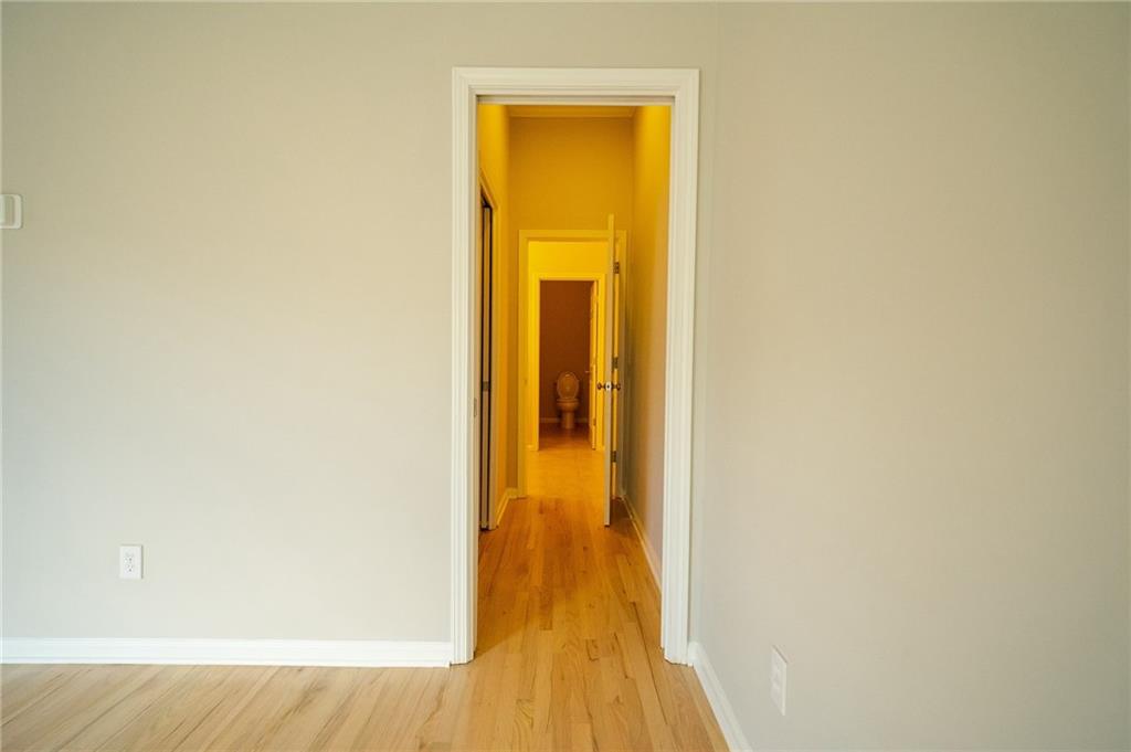 1207 Discover Green Lane, Unit 20 Mableton, GA 30126 - Photo 12 of 29 a view of a hallway with wooden floor
