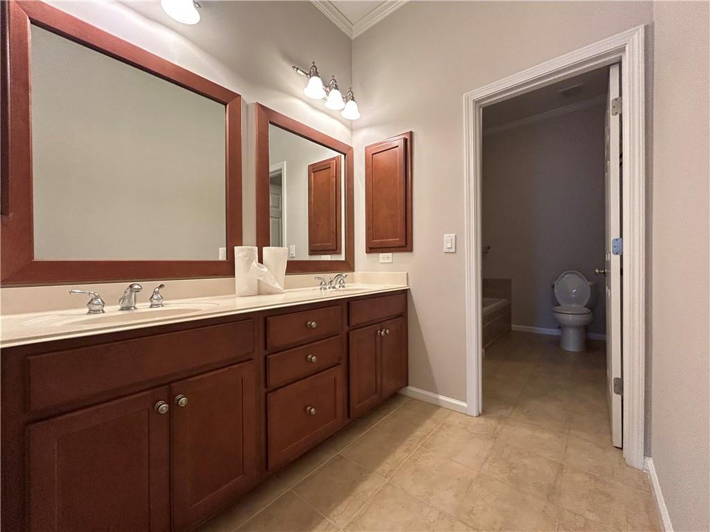 1207 Discover Green Lane, Unit 20 Mableton, GA 30126 - Photo 13 of 29 a spacious bathroom with a double vanity sink mirror and toilet
