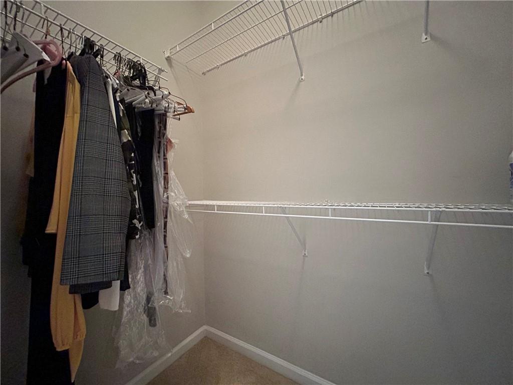 1207 Discover Green Lane, Unit 20 Mableton, GA 30126 - Photo 15 of 29 a view of walk in closet with clothes