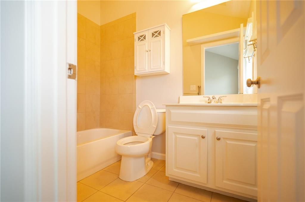 1207 Discover Green Lane, Unit 20 Mableton, GA 30126 - Photo 20 of 29 a bathroom with a sink a toilet and shower