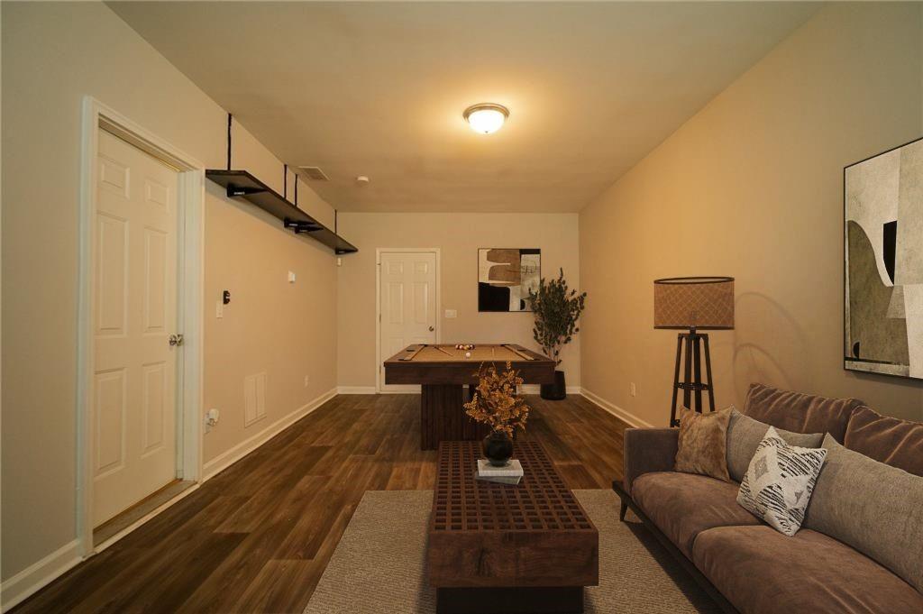 1207 Discover Green Lane, Unit 20 Mableton, GA 30126 - Photo 24 of 29 a living room with furniture and a rug