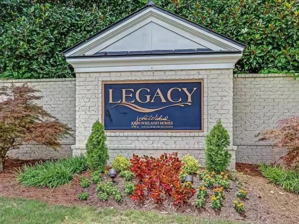 1207 Discover Green Lane, Unit 20 Mableton, GA 30126 - Photo 26 of 29 a sign that is sitting in front of a brick wall