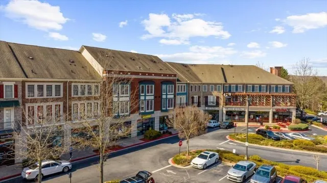 a front view of a house with outdoor seating