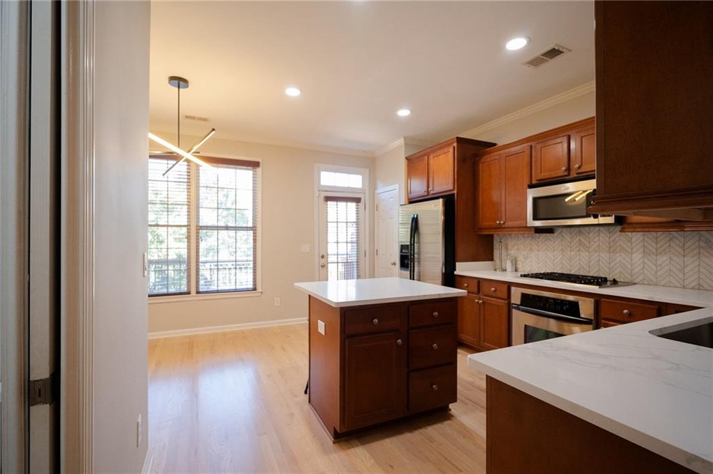 1207 Discover Green Lane, Unit 20 Mableton, GA 30126 - Photo 6 of 29 a kitchen with a sink stove and cabinets