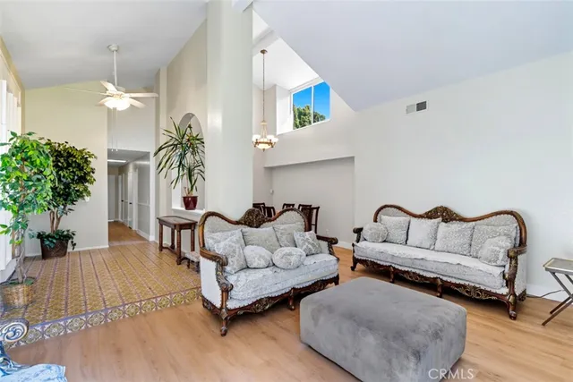 a view of a workspace with furniture and a potted plant