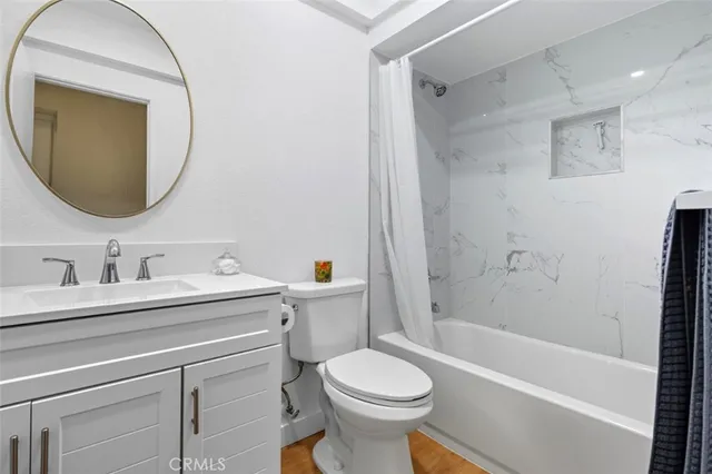 a living room with a fireplace furniture and a large window