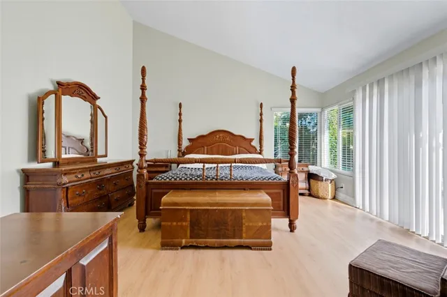 a kitchen with white cabinets and appliances