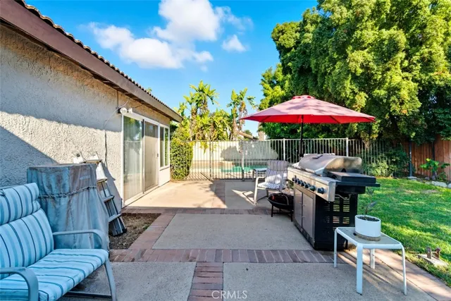 a view of yard with swimming pool and green space