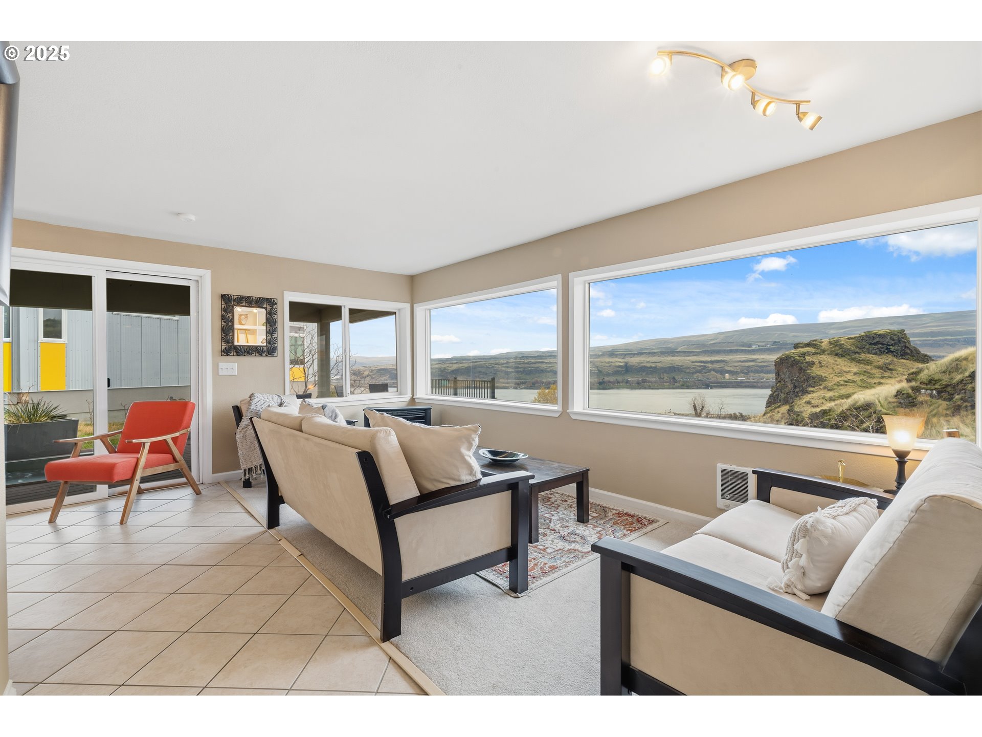 394 Fallbridge Road Wishram, WA 98673 - Photo 16 of 26 a living room with furniture and a large window