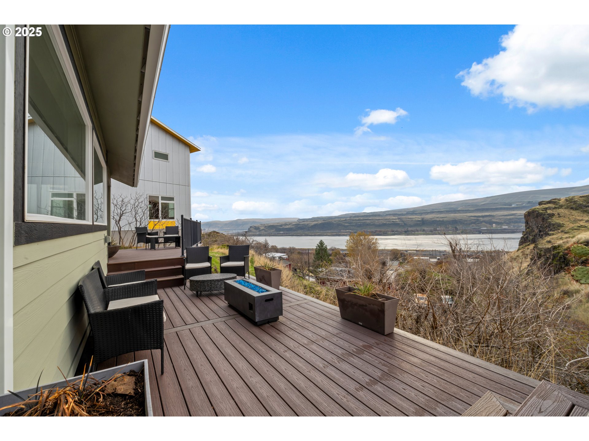 394 Fallbridge Road Wishram, WA 98673 - Photo 22 of 26 a view of a terrace with wooden floor and outdoor seating