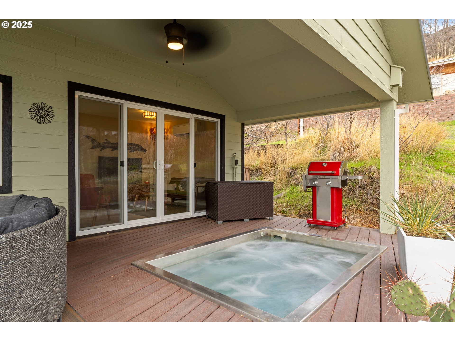394 Fallbridge Road Wishram, WA 98673 - Photo 3 of 26 a view of a living room with furniture and a flat screen tv