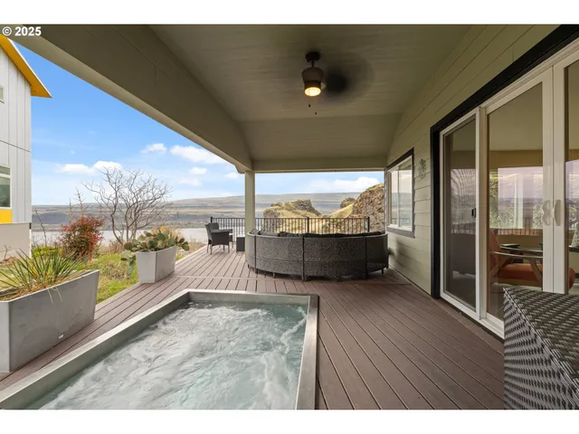 a view of a living room and floor to ceiling window or kitchen