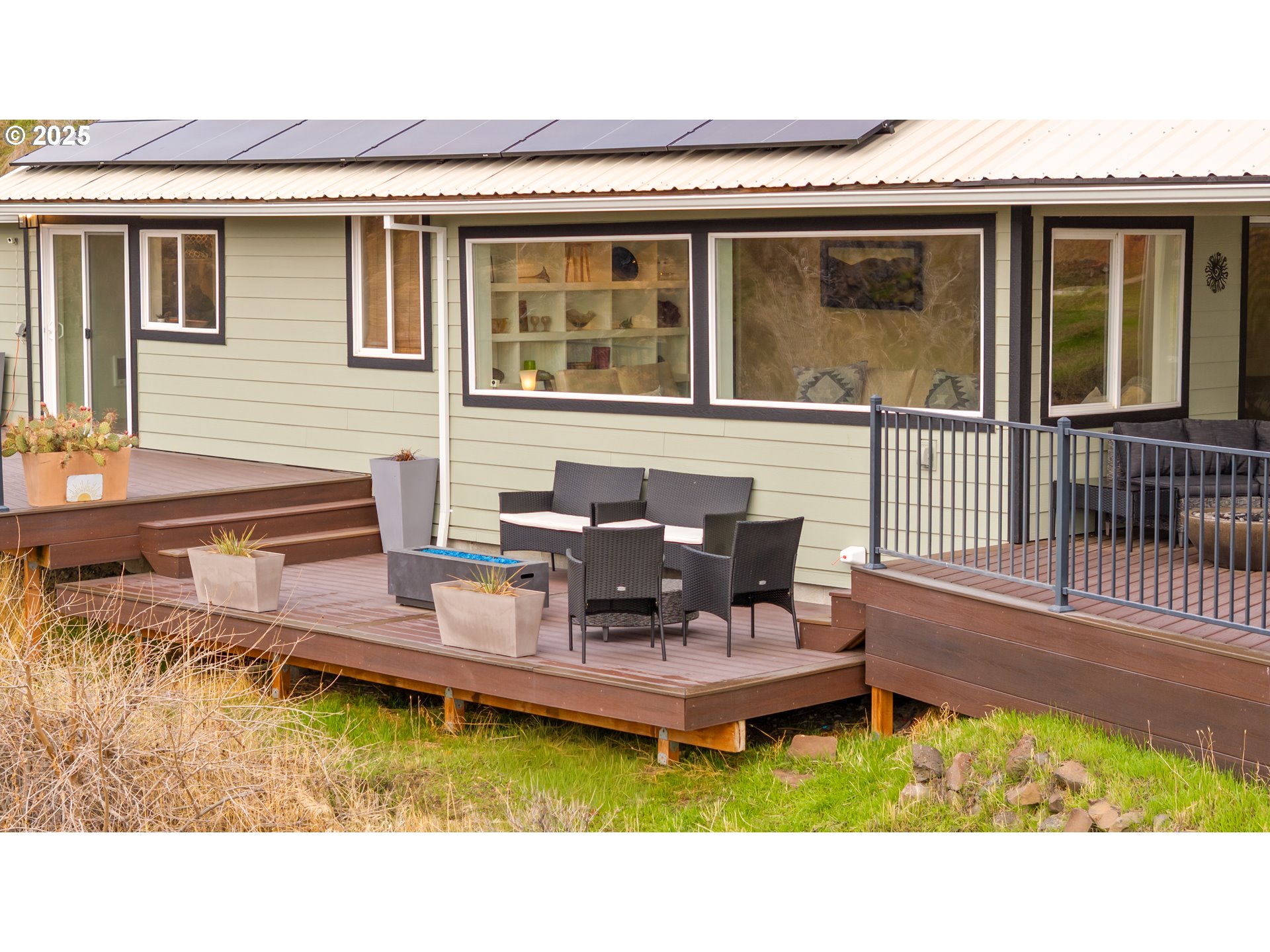 394 Fallbridge Road Wishram, WA 98673 - Photo 7 of 26 a white house sitting in front of a house