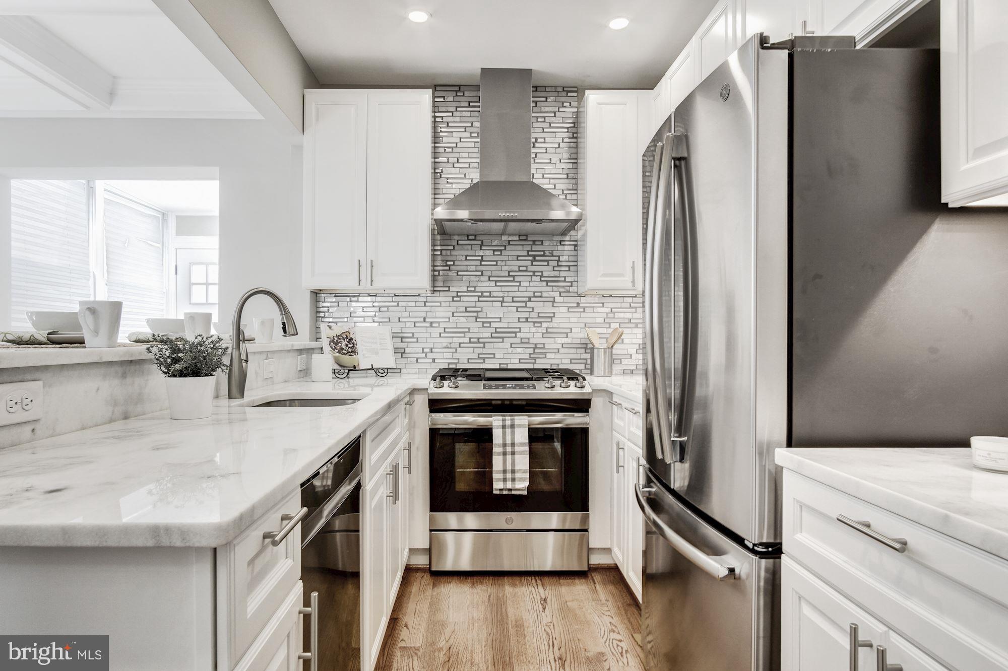 1508 Spring Place Northwest Washington, DC 20010 - Photo 16 of 48 High end GE appliances and stylish range hood!