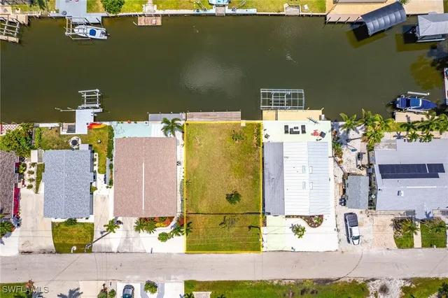 an aerial view of a house with a lake view