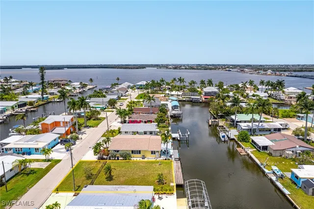 an aerial view of a residential building with outdoor space