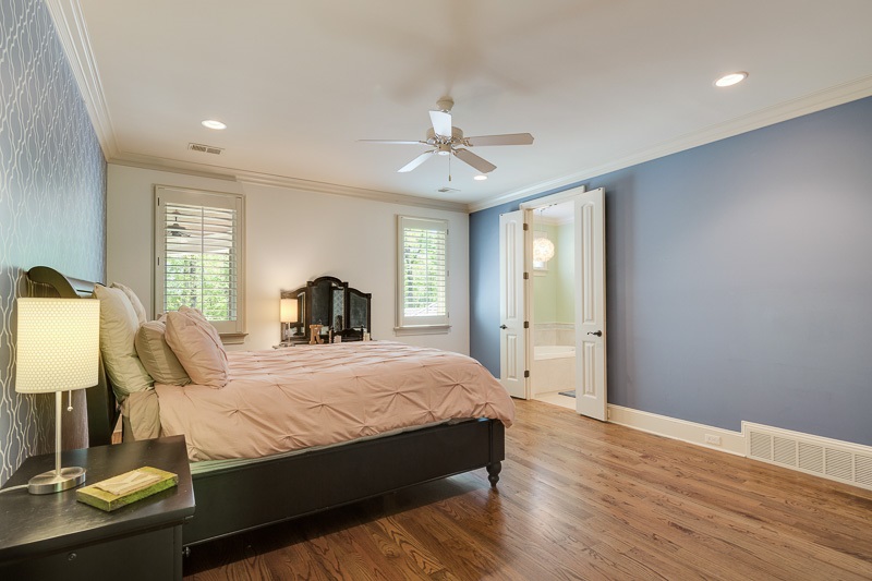 336 Pisgah Road Eads, TN 38028 - Photo 15 of 25 Another large bedroom with wood flooring offers double doors to a private and impressive full bath with granite and tile flooring, plus a walk in closet.