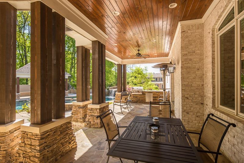 336 Pisgah Road Eads, TN 38028 - Photo 21 of 25 This space is perfect for dining or entertaining and offers an outdoor kitchen with a gas grill encased in a granite top, custom wood ceiling and columns, fans, plus recessed lights.