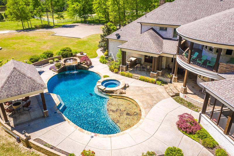 336 Pisgah Road Eads, TN 38028 - Photo 22 of 25 Alluring saltwater gunnite pool with multiple water features & heater, separate hot tub, custom gazebo with fire pit, and second floor balcony.