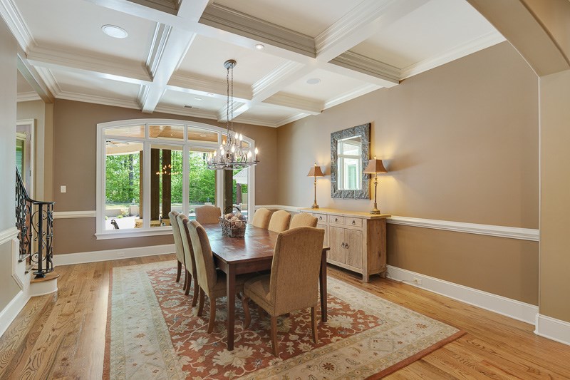 336 Pisgah Road Eads, TN 38028 - Photo 9 of 25 Intricate beamed ceiling with chandelier, recessed lights, gorgeous window with arch, chair rail, and arched opening highlight this lovely room.