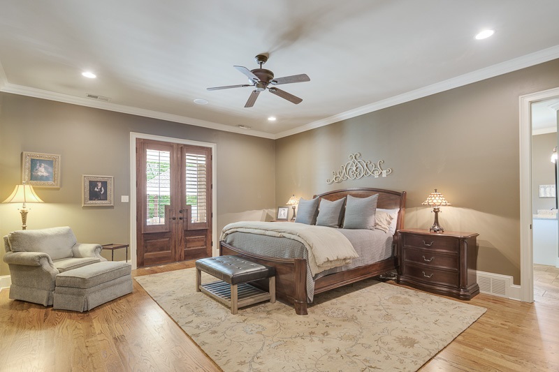 336 Pisgah Road Eads, TN 38028 - Photo 10 of 25 Luxurious master bedroom has hardwood floors, recessed lighting, double doors to patio, and surround sound, plus a HUGE walk in closet with multiple built ins.