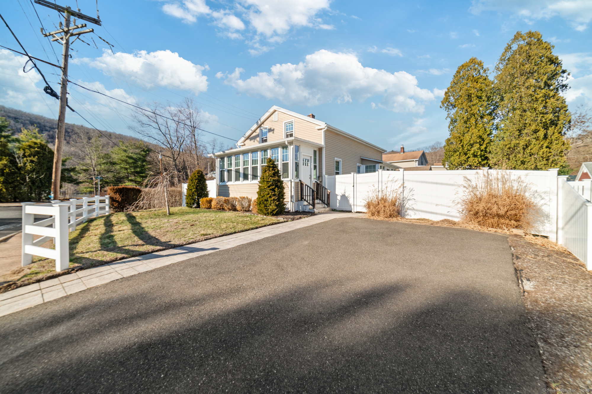 a view of a street with a building in the background