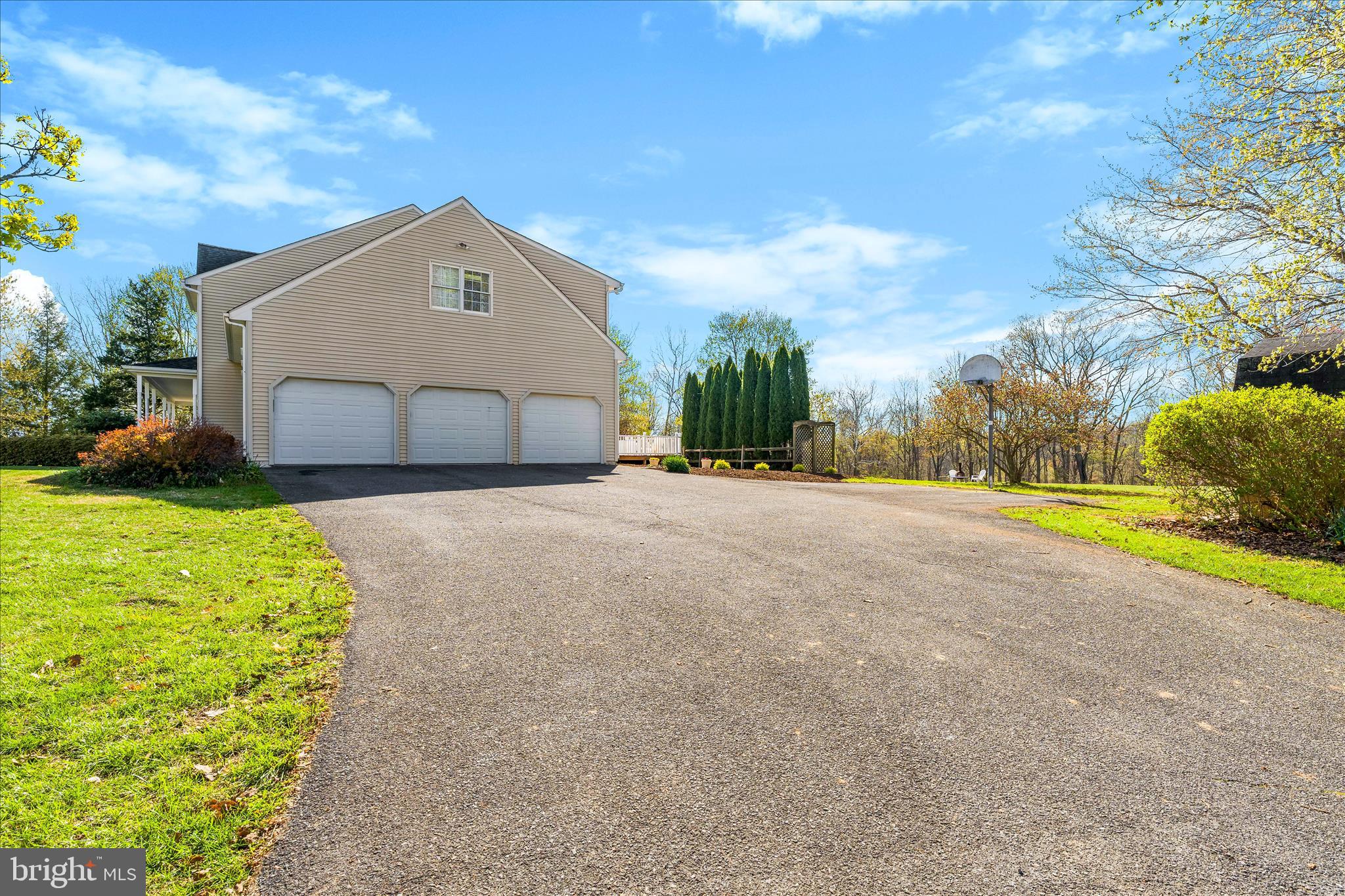3033 Averley Road Ijamsville, MD 21754 - Photo 13 of 115 a view of a house with a yard and garage