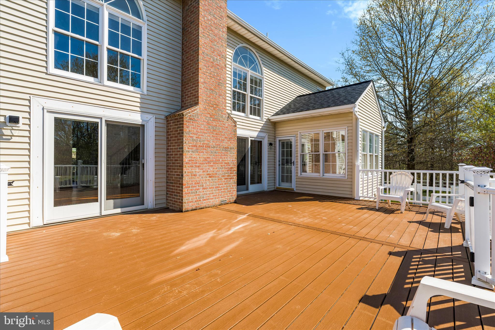 3033 Averley Road Ijamsville, MD 21754 - Photo 18 of 115 a backyard of a house with large trees and barbeque oven