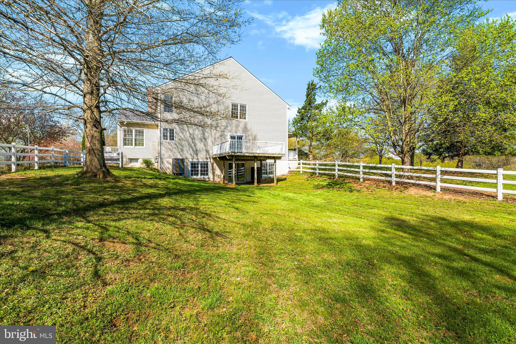 3033 Averley Road Ijamsville, MD 21754 - Photo 21 of 115 a view of a house with a big yard and large trees