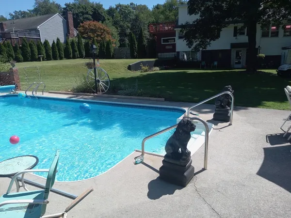 a view of a swimming pool with a patio