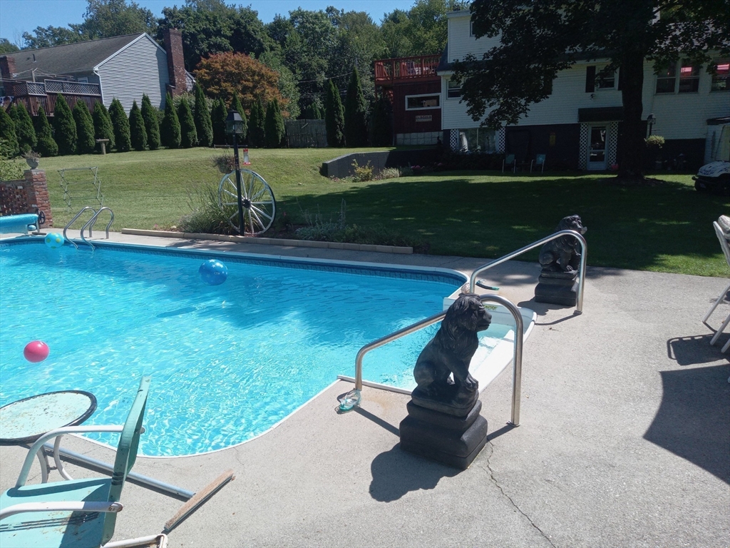 a view of a swimming pool with a patio